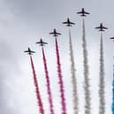 The Red Arrows take part in the fly past as they fly over The Mall after the coronation of King Charles III and Queen Camilla in London.