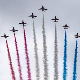 The Red Arrows take part in the fly past as they fly over The Mall after the coronation of King Charles III and Queen Camilla in London.