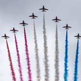The Red Arrows take part in the fly past as they fly over The Mall after the coronation of King Charles III and Queen Camilla in London.