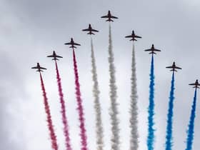 The Red Arrows take part in the fly past as they fly over The Mall after the coronation of King Charles III and Queen Camilla in London.
