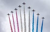 The Red Arrows take part in the fly past as they fly over The Mall after the coronation of King Charles III and Queen Camilla in London.