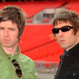 Oasis band members Noel Gallagher (left) and Liam Gallagher (right), during a photocall at Wembley Stadium in 2008. Photo: PA