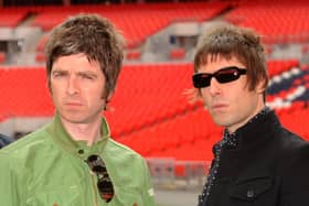 Oasis band members Noel Gallagher (left) and Liam Gallagher (right), during a photocall at Wembley Stadium in 2008. Photo: PA