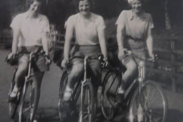 Mary Harvie cycling with her sisters Ella and Jean