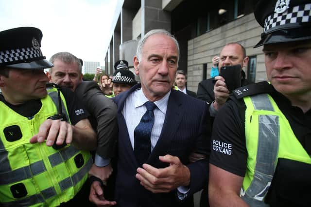 Former Rangers chief executive Charles Green leaves Glasgow Sheriff Court after he appeared in connection with the ''alleged fraudulent acquisition'' of the club in 2012.