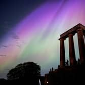 This photo taken and released by Jacob Anderson shows the northern lights or aurora borealis during a solar storm over the National Monument of Scotland in Edinburgh