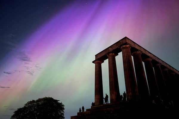 This photo taken and released by Jacob Anderson shows the northern lights or aurora borealis during a solar storm over the National Monument of Scotland in Edinburgh