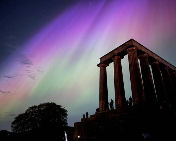 This photo taken and released by Jacob Anderson shows the northern lights or aurora borealis during a solar storm over the National Monument of Scotland in Edinburgh
