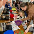 One of Signpost International's activities, family cooking classes using surplus food.