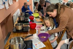 One of Signpost International's activities, family cooking classes using surplus food.