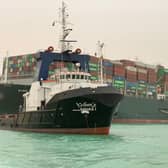 A giant container ship ran aground in the Suez Canal after a gust of wind blew it off course, the vessel's operator said on March 24, 2021, bringing marine traffic to a halt along one of the world's busiest trade routes.