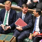 Chancellor of the Exchequer Jeremy Hunt (second from left) chatting with Prime Minister Rishi Sunak (second from right) after presenting the Spring Budget statement in the House of Commons in London. Picture: Jessica Taylor/UK Parliament/AFP via Getty Images