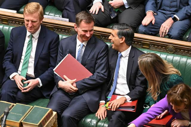 Chancellor of the Exchequer Jeremy Hunt (second from left) chatting with Prime Minister Rishi Sunak (second from right) after presenting the Spring Budget statement in the House of Commons in London. Picture: Jessica Taylor/UK Parliament/AFP via Getty Images