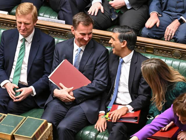 Chancellor of the Exchequer Jeremy Hunt (second from left) chatting with Prime Minister Rishi Sunak (second from right) after presenting the Spring Budget statement in the House of Commons in London. Picture: Jessica Taylor/UK Parliament/AFP via Getty Images