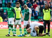 Hibs assistant manager Jamie McAllister and several players attempt to console the recently-bereaved Marijan Cabraja at the conclusion of their league draw with Rangers. Photo by Ross Parker / SNS Group