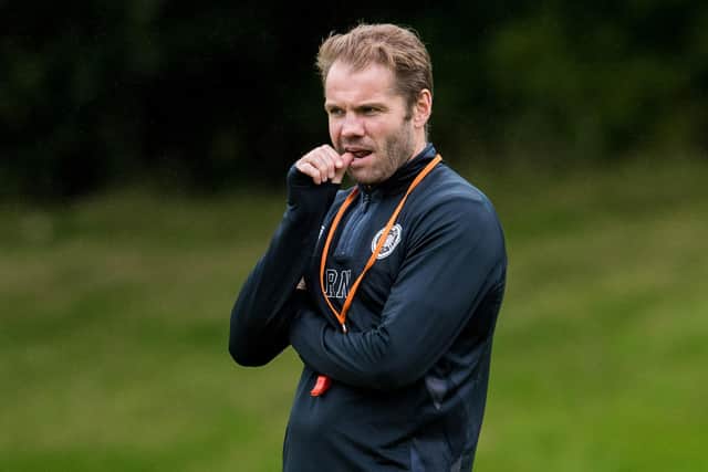 Hearts manager Robbie Neilson takes training - minus the injured Liam Boyce and Kye Rowles. (Photo by Ross Parker / SNS Group)