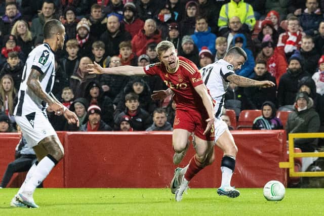 Aberdeen's Jack MacKenzie collides with PAOK's Adelino Vieirinha - but no penalty was given.