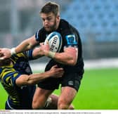 Glasgow's Kyle Steyn hands off Zebre's Enrico Lucchin's during the Warriors' win in Parma. Photo by Luca Sighinolfi/INPHO/Shutterstock