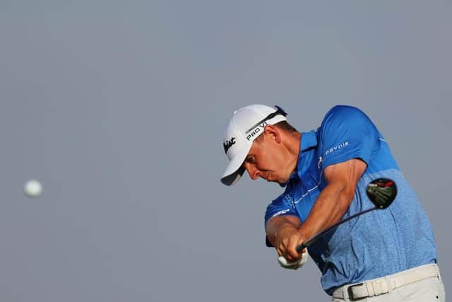 With Davy Kenny on his bag, Grant Forrest is pleased to have comfortably made the cut in the Abu Dhabi HSBC Championship at Yas Links. Picture: Andrew Redington/Getty Images.