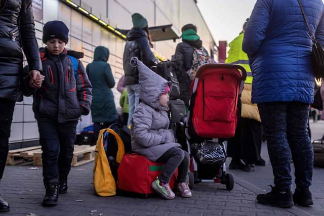 Ukrainian refugee families with children wait for further transport at the registration center in Przemysl, southeastern Poland, on March 19. Picture: WOJTEK RADWANSKI/AFP via Getty Images