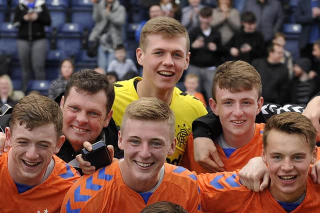 Nicky Hogarth among the Rangers squad celebrating the reserve league title in 2019.  (Picture: Michael Gillen)