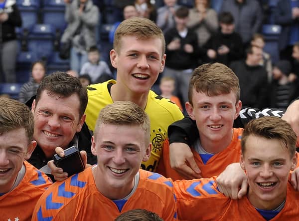Nicky Hogarth among the Rangers squad celebrating the reserve league title in 2019.  (Picture: Michael Gillen)