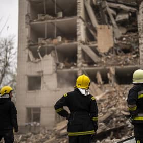 Firefighters work on a building partially destroyed after a Russian bombardment in Chernihiv, Ukraine. Picture: AP Photo/Francisco Seco