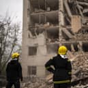 Firefighters work on a building partially destroyed after a Russian bombardment in Chernihiv, Ukraine. Picture: AP Photo/Francisco Seco