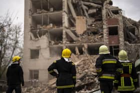 Firefighters work on a building partially destroyed after a Russian bombardment in Chernihiv, Ukraine. Picture: AP Photo/Francisco Seco