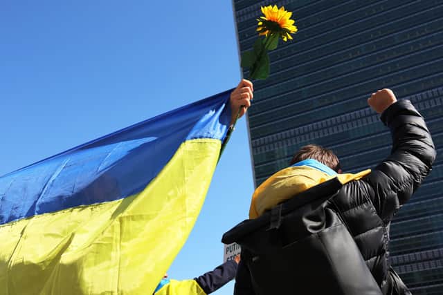 People gather to protest the war in Ukraine in front of the United Nations headquarters on March 02, 2022 in New York City. (Image credit: Michael M. Santiago/Getty Images)