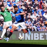 Rangers' Cyriel Dessers and Hibs' Jack Iredale battle for the ball during a Premiership match at Ibrox earlier this month (Picture: Andrew Milligan/PA Wire)