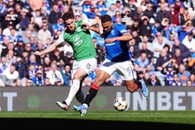 Rangers' Cyriel Dessers and Hibs' Jack Iredale battle for the ball during a Premiership match at Ibrox earlier this month (Picture: Andrew Milligan/PA Wire)