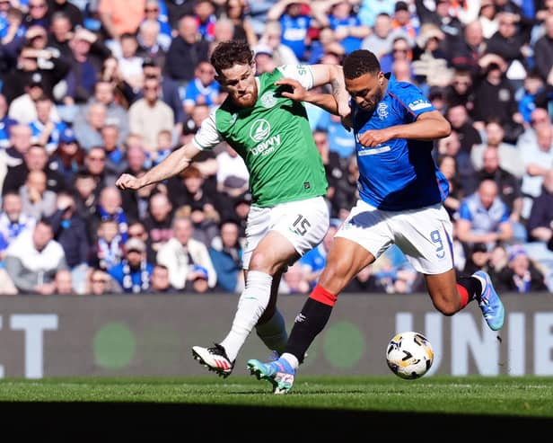 Rangers' Cyriel Dessers and Hibs' Jack Iredale battle for the ball during a Premiership match at Ibrox earlier this month (Picture: Andrew Milligan/PA Wire)