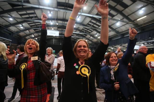 SNP supporters celebrate as the 2015 general election results come in, with the party going on to receive a record 49.97 per cent of the vote (Picture: Andrew Milligan/PA)
