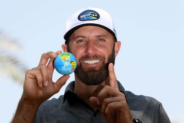 World No 1 Dustin Johnson poses with a globe ahead of the Saudi International powered by SoftBank Investment Advisers at Royal Greens Golf and Country Club in King Abdullah Economic City. Picture: Ross Kinnaird/Getty Images.