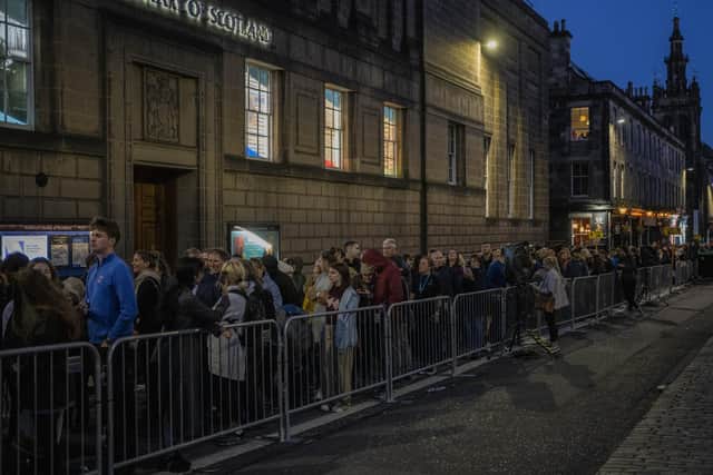 People queue to see the coffin of Queen Elizabeth II as she lies at rest at St Giles Cathedral in Edinburgh