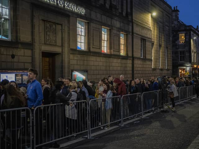 People queue to see the coffin of Queen Elizabeth II as she lies at rest at St Giles Cathedral in Edinburgh