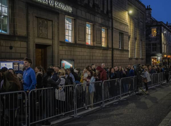 People queue to see the coffin of Queen Elizabeth II as she lies at rest at St Giles Cathedral in Edinburgh