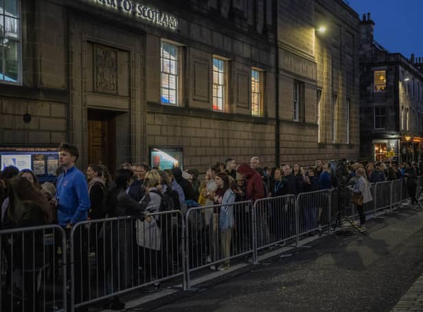 People queue to see the coffin of Queen Elizabeth II as she lies at rest at St Giles Cathedral in Edinburgh
