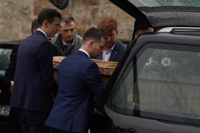 Pall bearers carry the casket from the hearse at the funeral of TV presenter and journalist Nick Sheridan, at St Ibar's Church in Castlebridge, Co Wexford. Picture: Brian Lawless/PA Wire