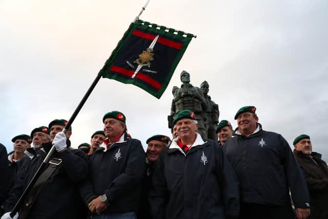 Military personnel and veterans have a picture taken after a Remembrance Sunday service and parade at the Commando Memorial at Spean Bridge, on the 100th anniversary of the signing of the Armistice which marked the end of the First World War.