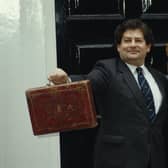 Nigel Lawson, former Chancellor of the Exchequer, with his wife Thérèse outside 11 Downing Street in London on Budget Day, 17th March 1987. (Photo by Fox Photos/Hulton Archive/Getty Images)