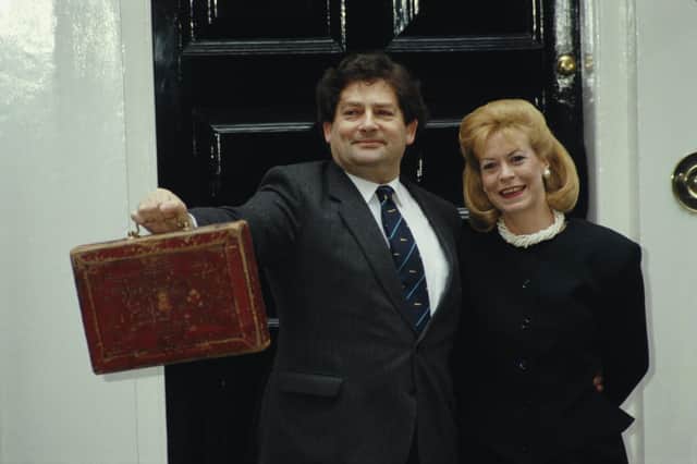 Nigel Lawson, former Chancellor of the Exchequer, with his wife Thérèse outside 11 Downing Street in London on Budget Day, 17th March 1987. (Photo by Fox Photos/Hulton Archive/Getty Images)