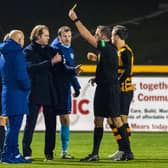 Hearts manager Robbie Neilson (left) and Andy Halliday confront the referee Gavin Duncan at full time at Alloa.