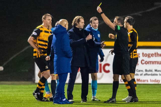 Hearts manager Robbie Neilson (left) and Andy Halliday confront the referee Gavin Duncan at full time at Alloa.