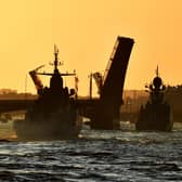 Russian warships sail on the Neva river through raised drawbridges during a rehearsal for the Naval parade in Saint Petersburg. Picture: Olga Maltseva/AFP via Getty Images