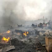 Rohingya refugees try to salvage their belongings after a major fire in their Balukhali camp at Ukhiya in Cox's Bazar district, Bangladesh.
