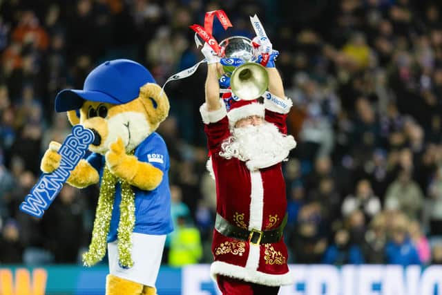 Santa parades the Viaplay Cup during half-time of Rangers' 2-0 win over St Johnstone at Ibrox. (Photo by Craig Foy / SNS Group)