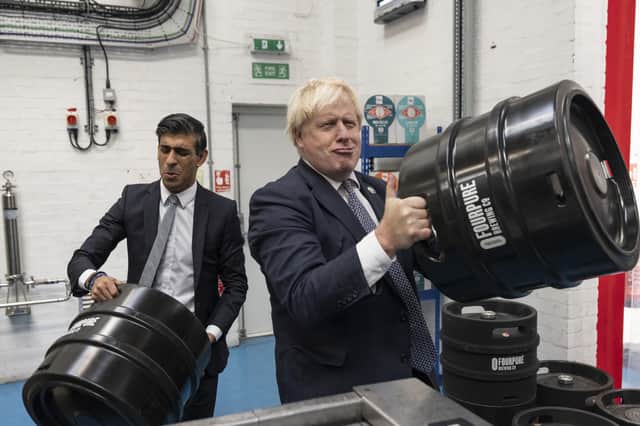 Prime Minister Boris Johnson with Chancellor of the Exchequer Rishi Sunak during a visit to Fourpure Brewery in Bermondsey, London, after Sunak delivered his Budget to the House of Commons.