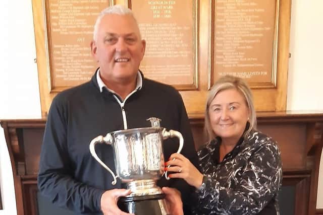 Andy Marshall, pictured with wife Norma, shows off the Prestwick St Nicholas club championship trophy.